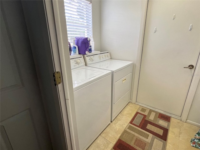 washroom featuring light tile patterned flooring and separate washer and dryer