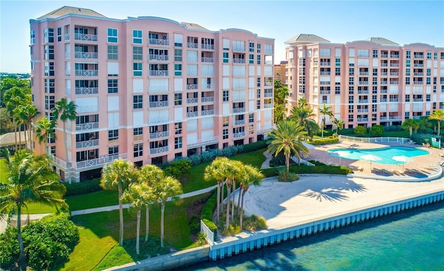 view of property featuring a community pool