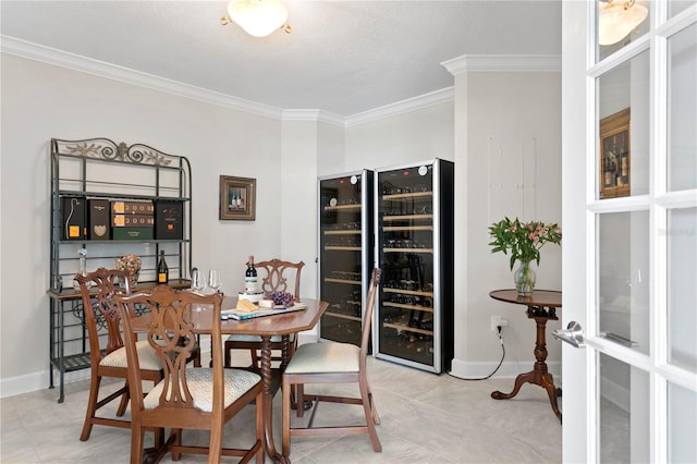 dining area with beverage cooler, a textured ceiling, and ornamental molding