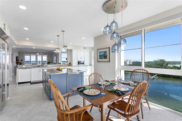 dining area featuring a water view