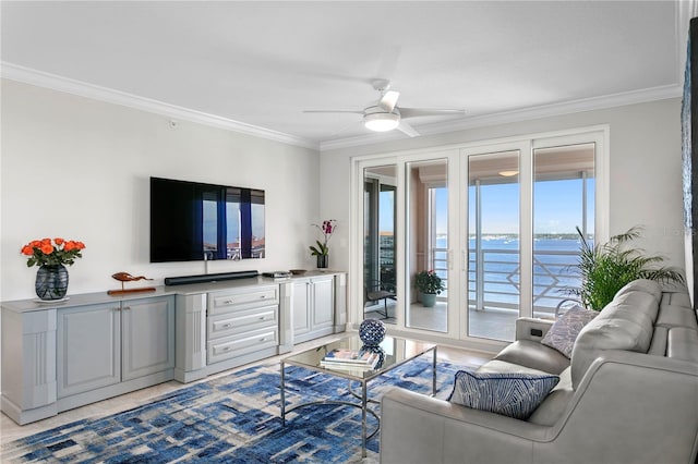 living room featuring ceiling fan and crown molding