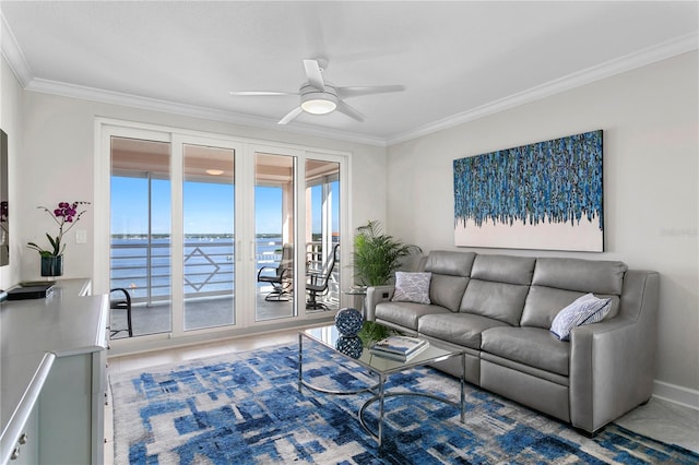 living room with a water view, ceiling fan, and crown molding