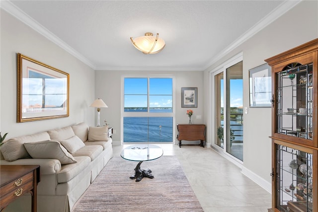 living room featuring a wealth of natural light, a water view, and crown molding