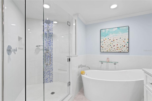 bathroom featuring tile patterned floors, tile walls, vanity, crown molding, and independent shower and bath