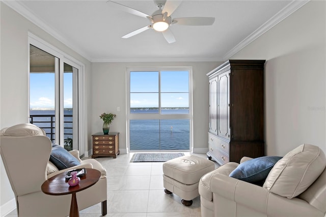 living area featuring light tile patterned flooring, a water view, ceiling fan, and crown molding