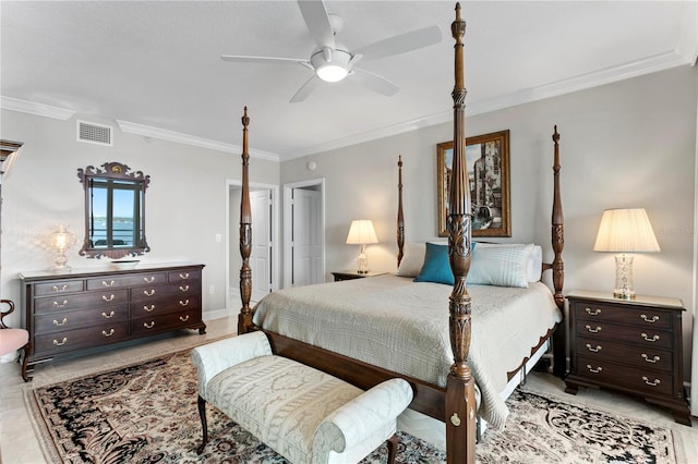 tiled bedroom with ornamental molding and ceiling fan