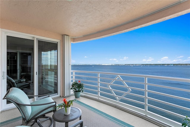 balcony featuring a water view