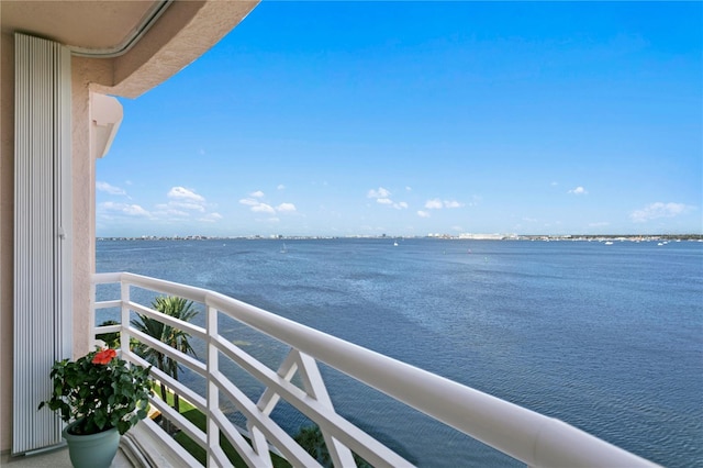 balcony featuring a water view