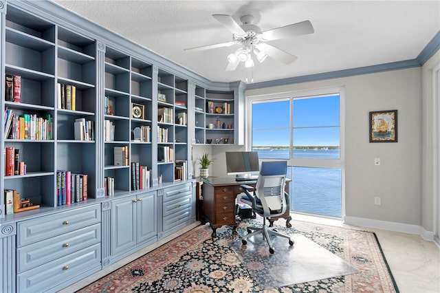 office space with ceiling fan, a textured ceiling, carpet, and ornamental molding