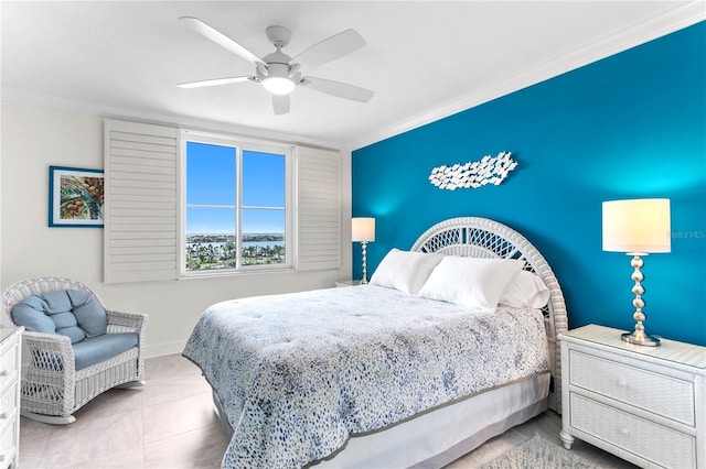 bedroom with ceiling fan, light tile patterned floors, and ornamental molding