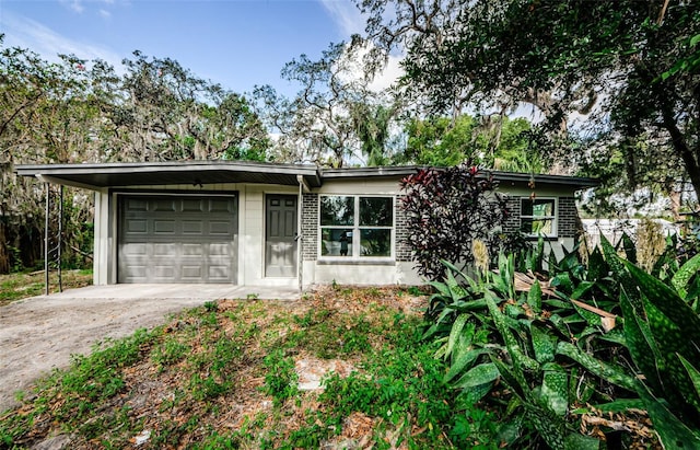 ranch-style house featuring a garage