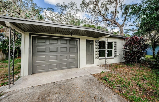 single story home with a garage