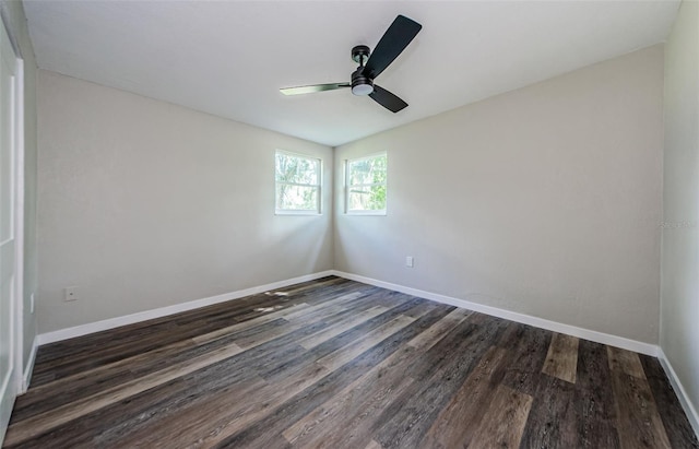 empty room with dark wood-type flooring and ceiling fan