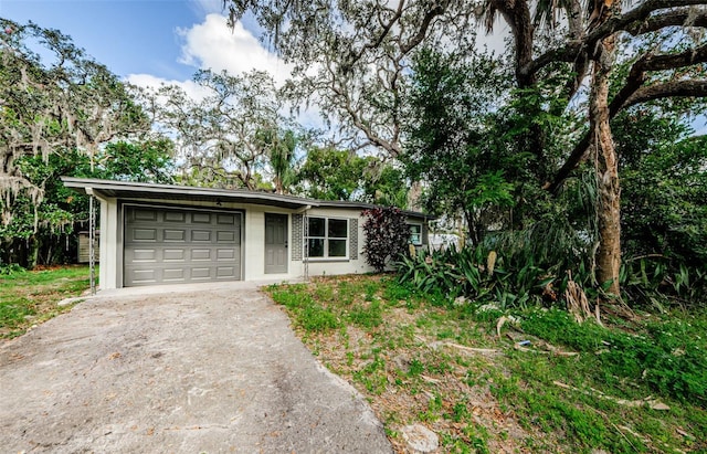 single story home with a garage