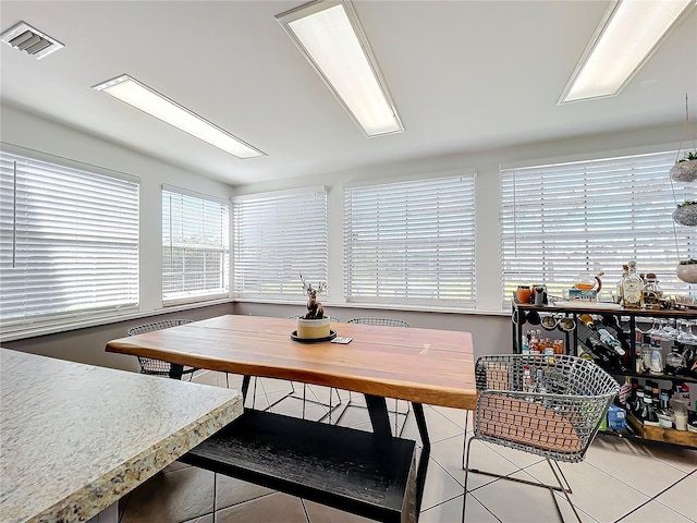 tiled dining area featuring breakfast area