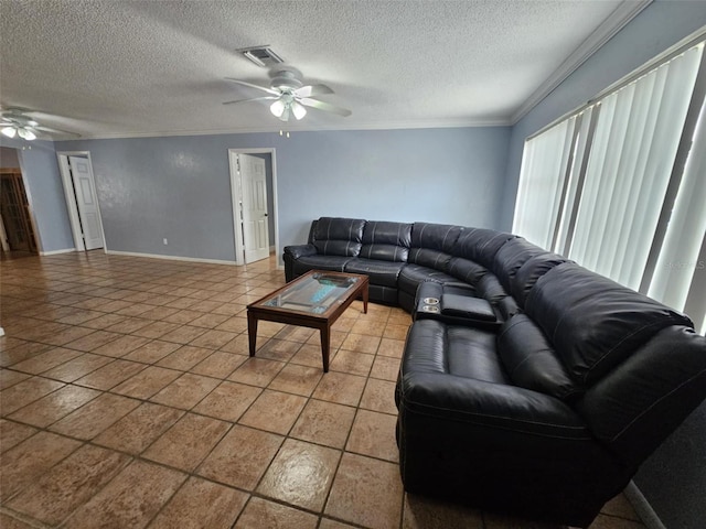 living room featuring a textured ceiling, ornamental molding, and ceiling fan