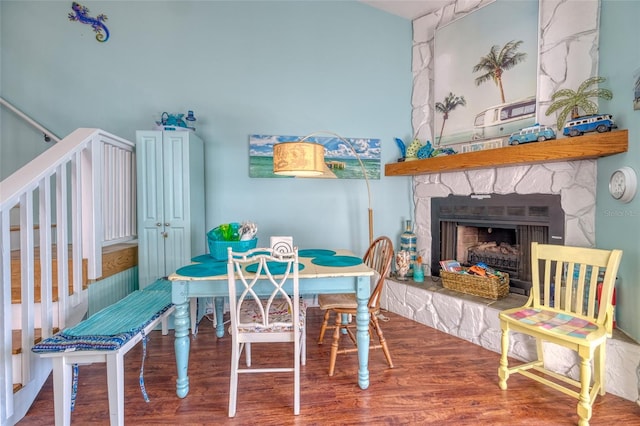 interior space with a fireplace and wood-type flooring