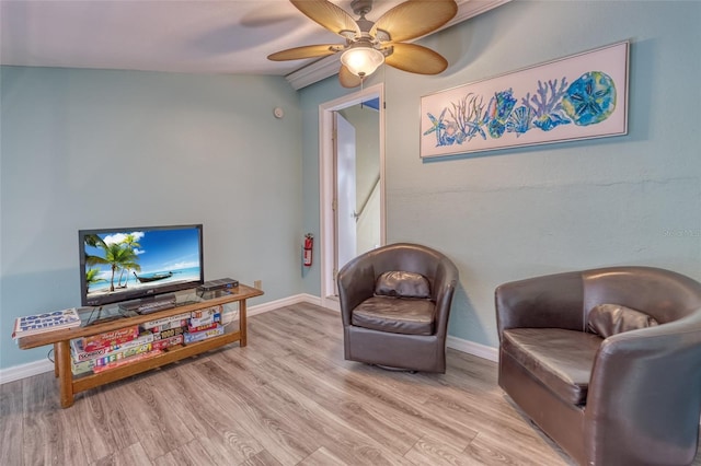 sitting room with light hardwood / wood-style floors, lofted ceiling, and ceiling fan