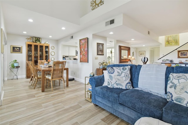 living room with light hardwood / wood-style flooring