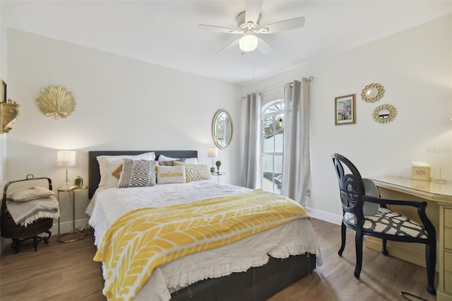 bedroom with ceiling fan and wood-type flooring