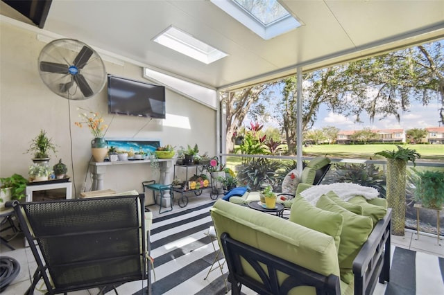 sunroom / solarium featuring a healthy amount of sunlight and lofted ceiling