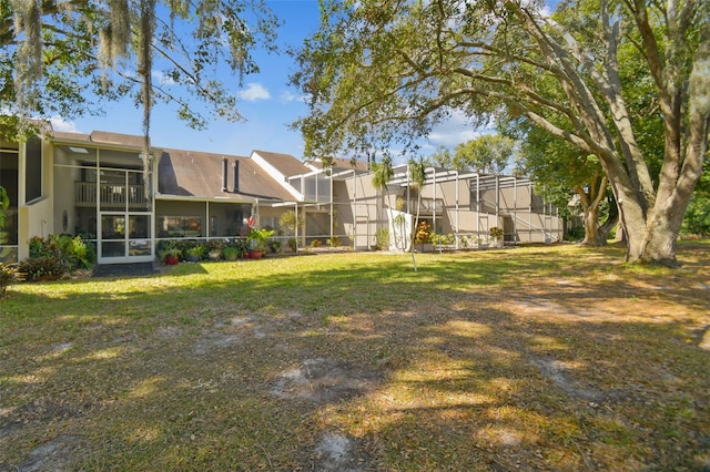 view of yard featuring a sunroom