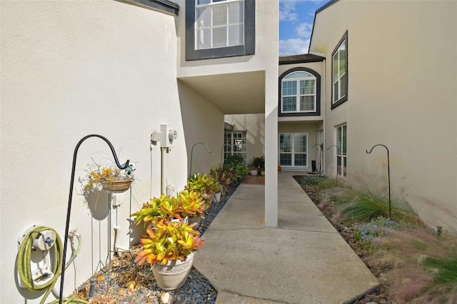 property entrance featuring a patio area