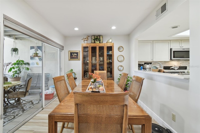 dining room with light hardwood / wood-style floors