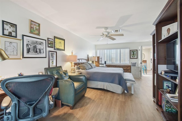 bedroom with ceiling fan and light wood-type flooring