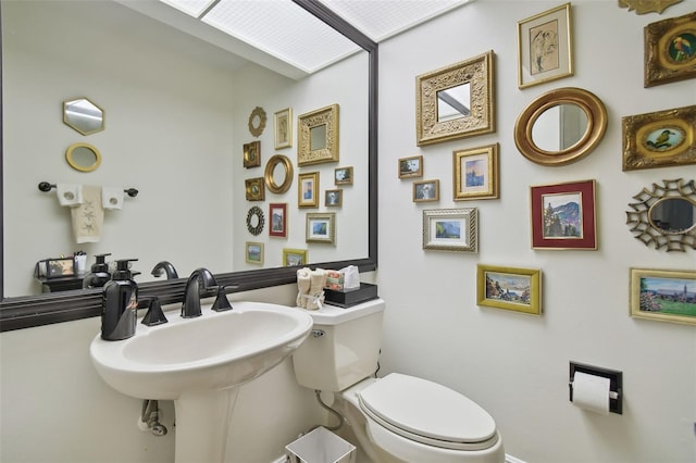 bathroom with toilet and sink