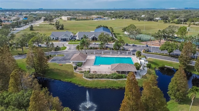 birds eye view of property with a water view