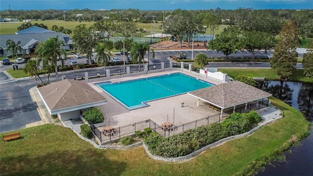 view of pool with a water view