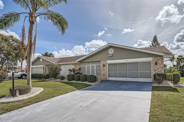 ranch-style home with a garage and a front yard