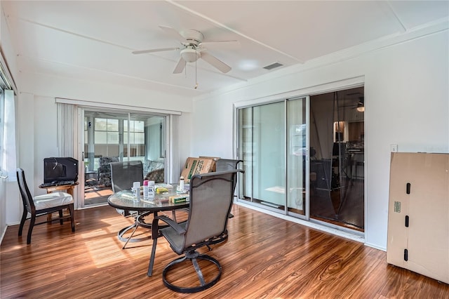 interior space with ceiling fan