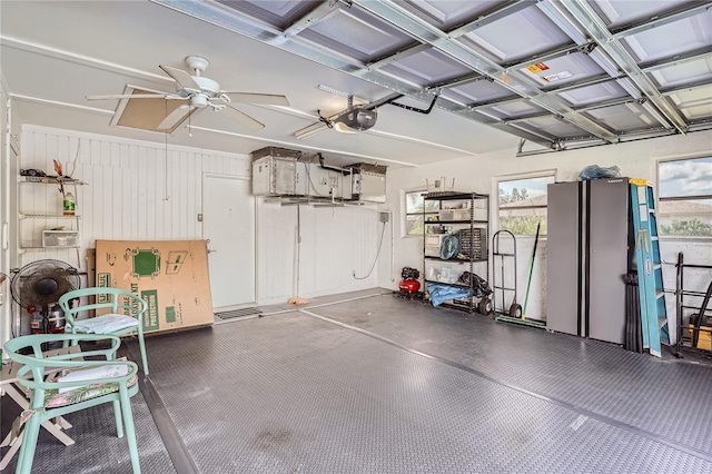 garage featuring a garage door opener and ceiling fan