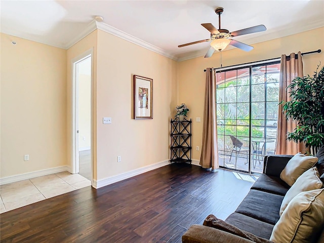 living room featuring ceiling fan, wood-type flooring, and ornamental molding