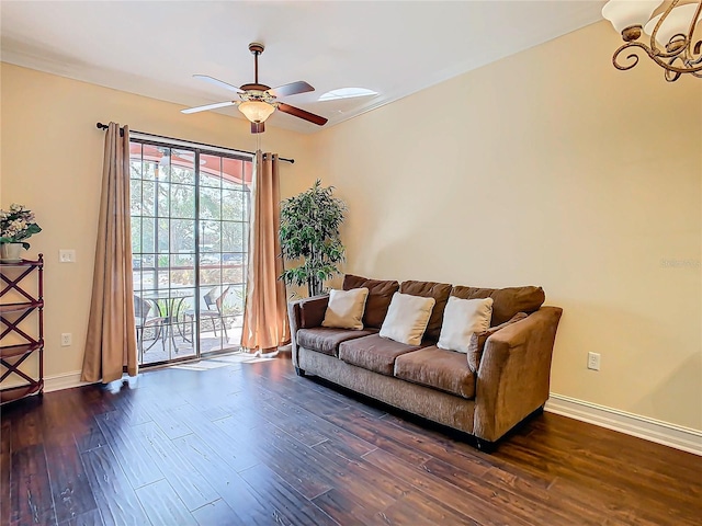 living room featuring dark hardwood / wood-style floors and ceiling fan