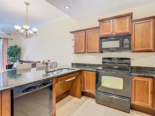 kitchen featuring black appliances, sink, a chandelier, light tile patterned floors, and decorative light fixtures