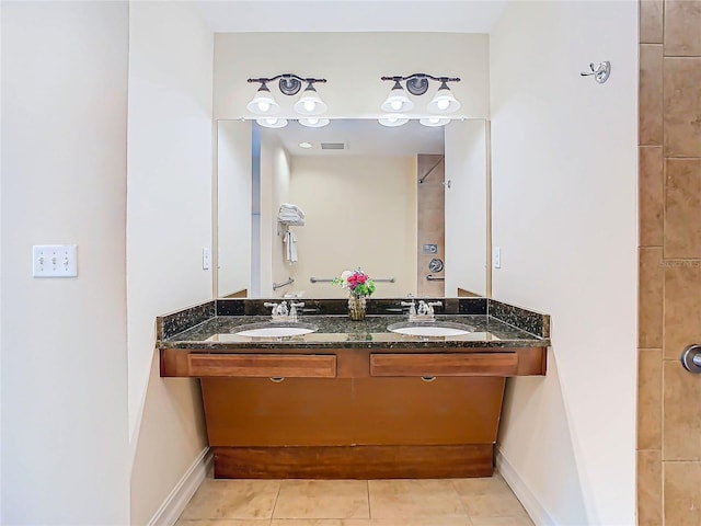 bathroom featuring vanity and tile patterned flooring