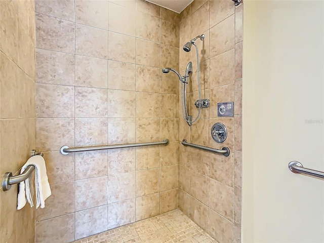 bathroom with tiled shower