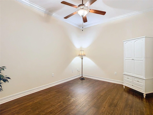 spare room featuring ornamental molding, dark hardwood / wood-style flooring, and ceiling fan