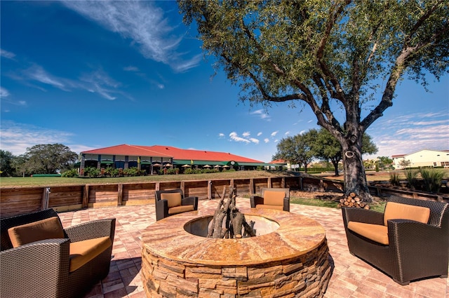 view of patio / terrace featuring an outdoor fire pit