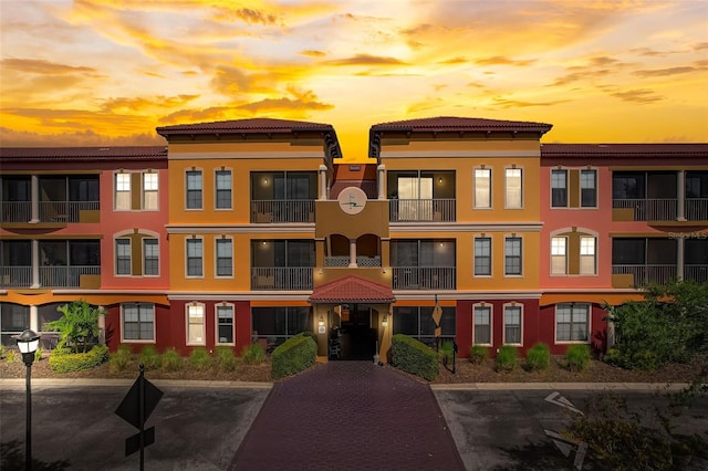 view of outdoor building at dusk