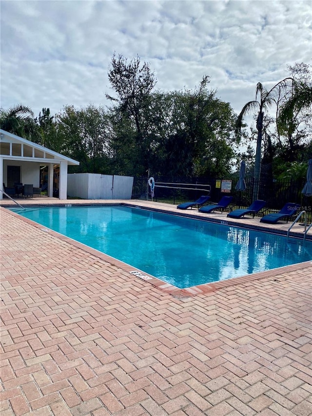 view of swimming pool featuring a patio