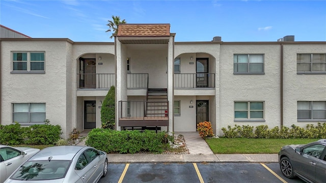 view of front of property with a balcony