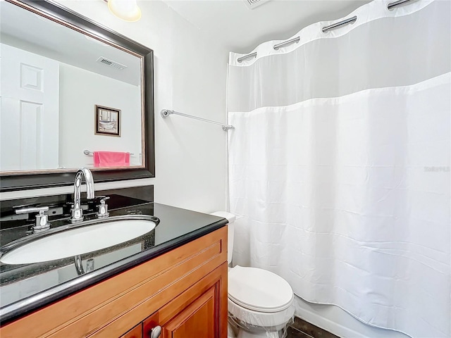 full bathroom with toilet, shower / bath combo, and vanity