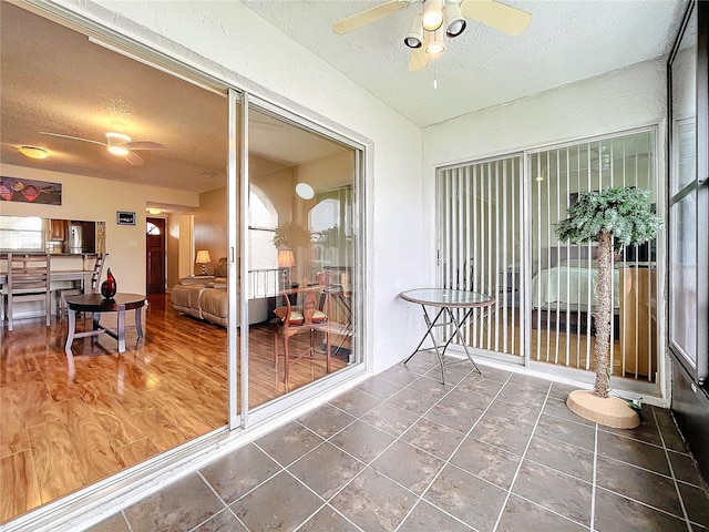 sunroom / solarium with ceiling fan