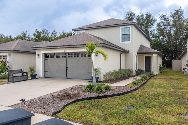 view of front of home featuring a garage and a front yard