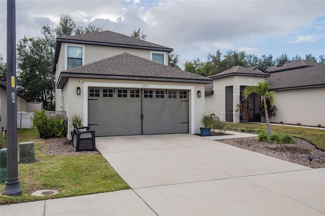 view of front of house with a garage and a front yard