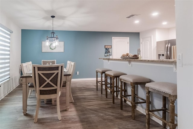 dining room featuring dark hardwood / wood-style flooring